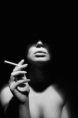 Obraz premium black and white portrait of Beautiful woman with a cigarette