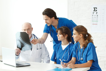 Medical team checking X-ray results