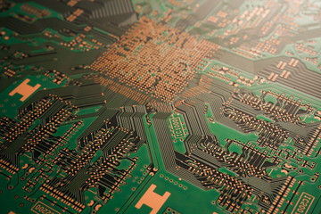 A close-up of black Green coloured Printed circuit board (PCB) with no component mounted (copper exposed)