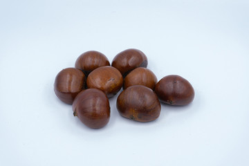 Chestnut Isolated. Roasted sweet chestnuts for Christmas and Chinese New Year on white background. Top view. Flat lay.