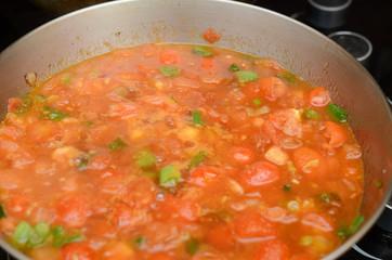 A cooking tomato sauce on pan