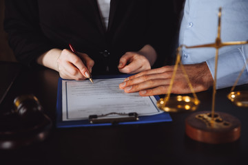 Business - meeting in an office, lawyers or attorneys discussing a document or contract agreement.