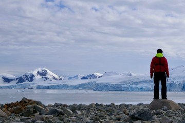 Explorer before glacier on antarctic Island, Antarctica, Stonington Island