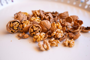 Fototapeta na wymiar pilled walnut isolated on white background. Composition from nuts on the white isolated background