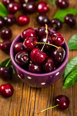Cherry on Wooden Background. Selective focus.