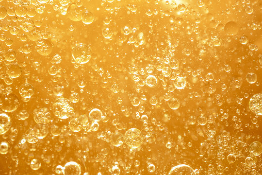 golden yellow bubble oil droplet, abstract background