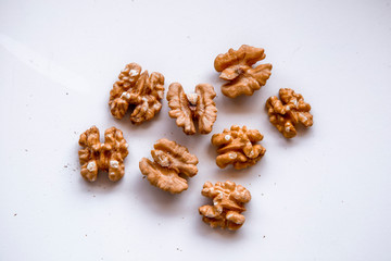 pilled walnut isolated on white background. Composition from nuts on the white isolated background