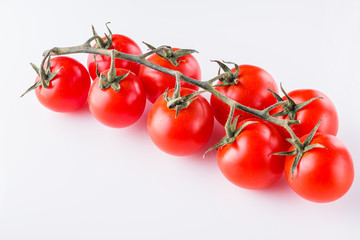 juicy fresh cherry tomatoes on a white background
