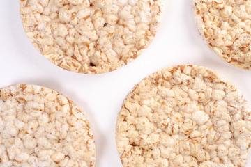 Puffed rice cakes on white background. Flat lay, top view. Rice waffle. copy space