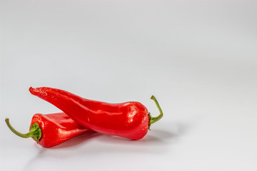 Ugly spoiled organic pepper on a white background  with copy space. Food waste concept. Horizontal...
