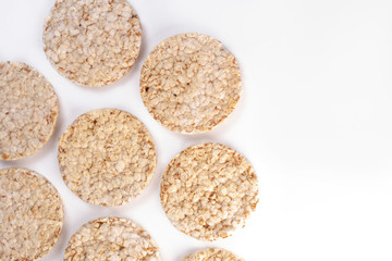Puffed rice cakes on white background. Flat lay, top view. Rice waffle. copy space