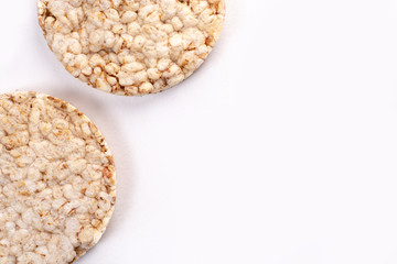Puffed rice cakes on white background. Flat lay, top view. Rice waffle. copy space