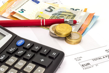 Close up of invoice with calculator and pen