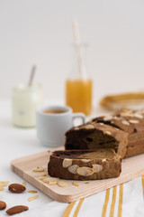 Home made banana bread for breakfast with coffee, juice and yoghurt