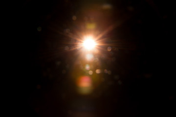 Abstract Natural Sun flare on the black background.