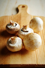 Mushroom on wooden cutting board 