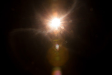 Abstract Natural Sun flare on the black background.