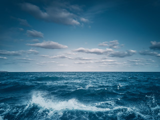 Fototapeta na wymiar Waves amd sea ripple water with blue clody sky