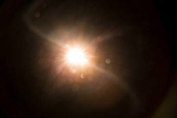 Abstract Natural Sun flare on the black background.