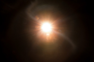 Abstract Natural Sun flare on the black background.