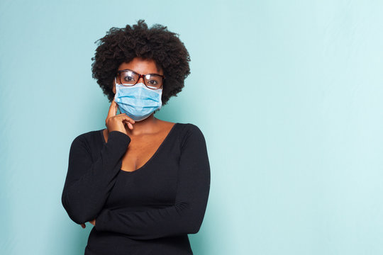 Black Woman With Black Power Hair Wearing Protective Mask Wearing Reading Glasses