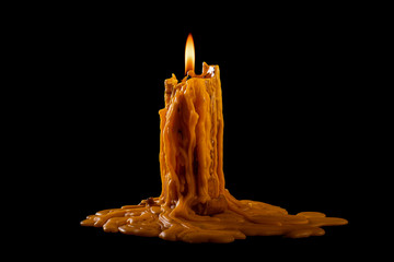 light flame candle burning brightly on black background