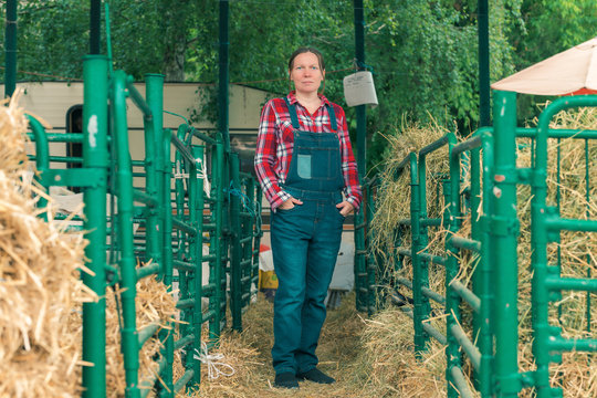 Female farmer posing on goat farm