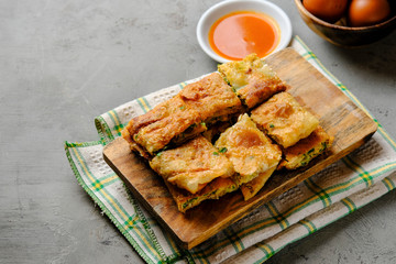Martabak Telor or Martabak Telur. Savory pan-fried pastry stuffed with egg, meat and spices