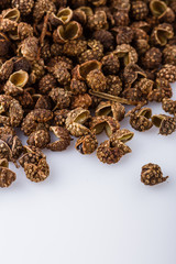 fragrant Sichuan pepper on white acrylic background