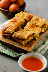Martabak Telor or Martabak Telur. Savory pan-fried pastry stuffed with egg, meat and spices