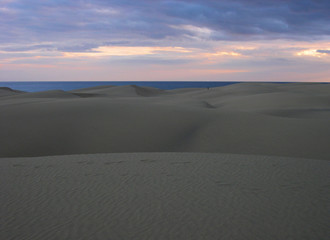 Beautiful view of the dunes in Maspalomas beach during the sunset. South of Gran Canaria Island. Spain.