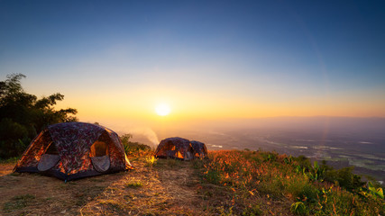 Landscape of sunrise or sunset over tent in nation park. Concept camping or picnic with eco vacation