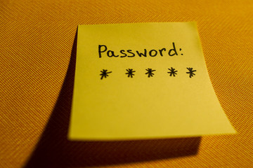 Secret password written on paper note on background. Login access, encryption and cyber security concepts.