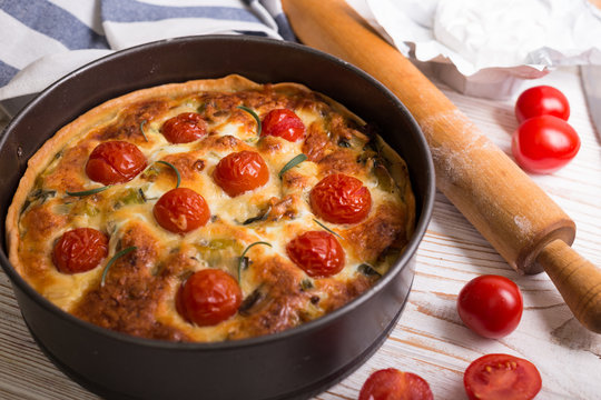 pie with  cheese brie and cherry tomatoes - Powered by Adobe