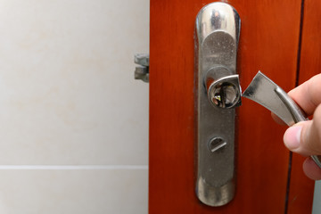a broken metal lock on the door