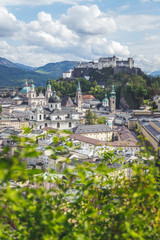 Naklejka premium Salzburg summer time: Panoramic city landscape with Salzach and historic district