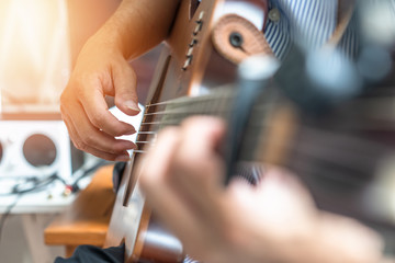 Electric guitar player or guitarlist playing live music show or rehearsal for stag performance