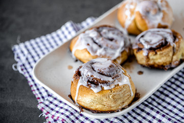 Fresh Homemade Cinnamon Rolls made on a plate with a napkin for breakfast