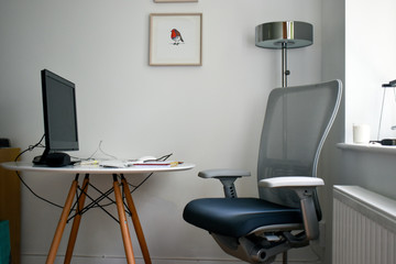 a living room converted into a home office. corona virus work from home during quarantine concept