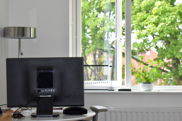 a living room converted into a home office. corona virus work from home during quarantine concept
