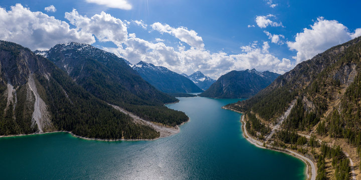 aerial view to blue lake plansee at spring with austrian mountain slps © A2LE
