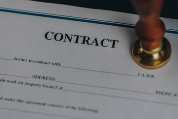 Notary contract with stamp on the desk isolated