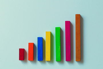 Concepts of strategic plans and business plans : create bar graphs and wooden bars. Business management Intelligence strategy planning for maximum efficiency