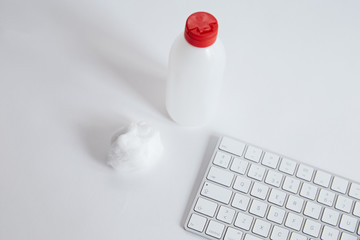 Coronavirus COVID-19 sanitize cleaning disinfection of work desk. Antibacterial wipe the surfaces...
