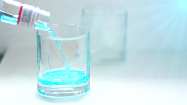 video glass with a blue alcoholic drink