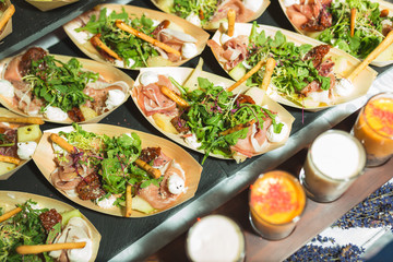 Small plates with appetizer, salad for guests of the event and celebration.