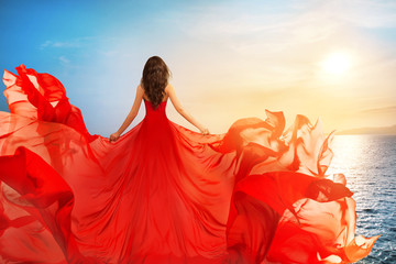 Woman Rear view in Red Flying Dress Fluttering on Wind, Girl in Waving Gown on Sundown Sea