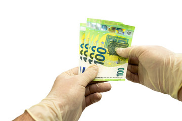 Two hands in white protective gloves hold a bundle of 100 Euro bills. Isolated white background. Virus protection concept.