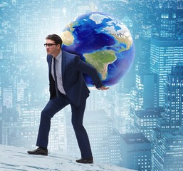 Businessman carrying Earth on his shoulders