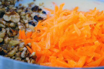 Making the batter for a vegan carrot cake in a bowl